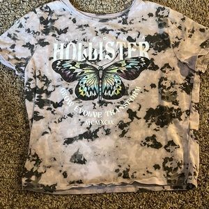 This is a cute Hollister butterfly shirt, size L, colors are purple, black etc.